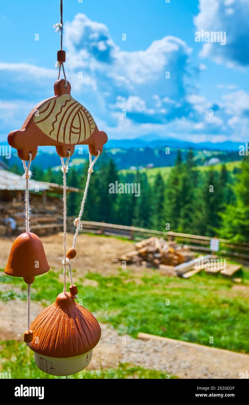 The handmade adobe wind chimes with house-bell, Mountain Valley Peppers handicraft village, Ukraine Stock Photo