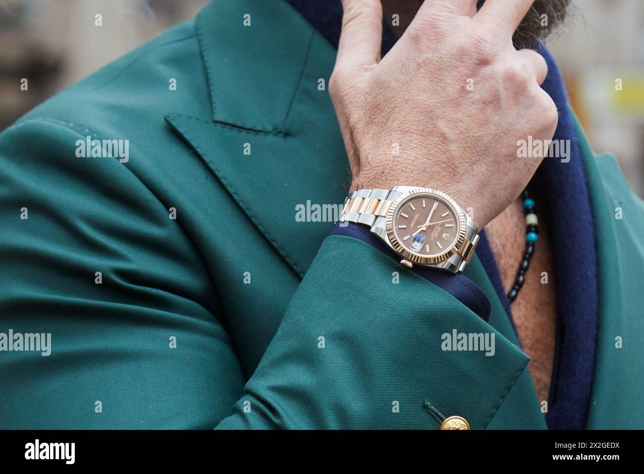 MILAN, ITALY - FEBRUARY 24 , 2024: Man with Rolex Datejust steel and gold before Dolce and Gabbana fashion show, Milan Fashion Week street style Stock Photo