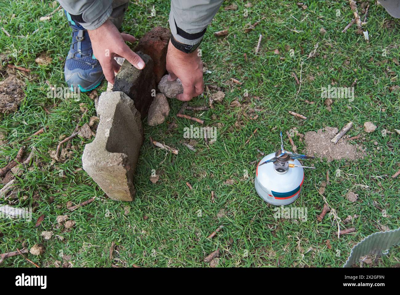 Hands of an unrecognizable person assembling a structure to stop the ...