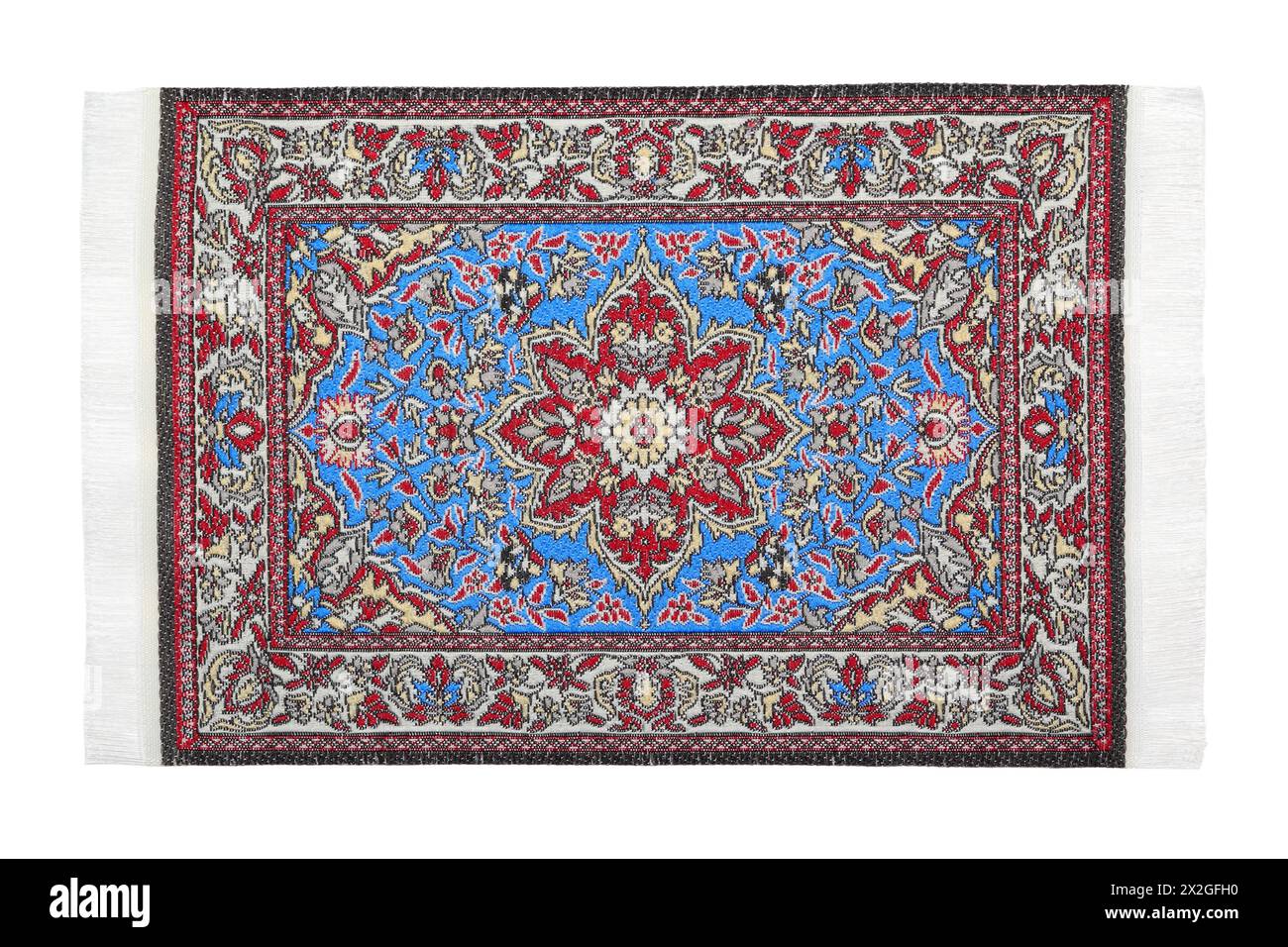 One oriental red-blue carpet horizontally lies on  white background Stock Photo