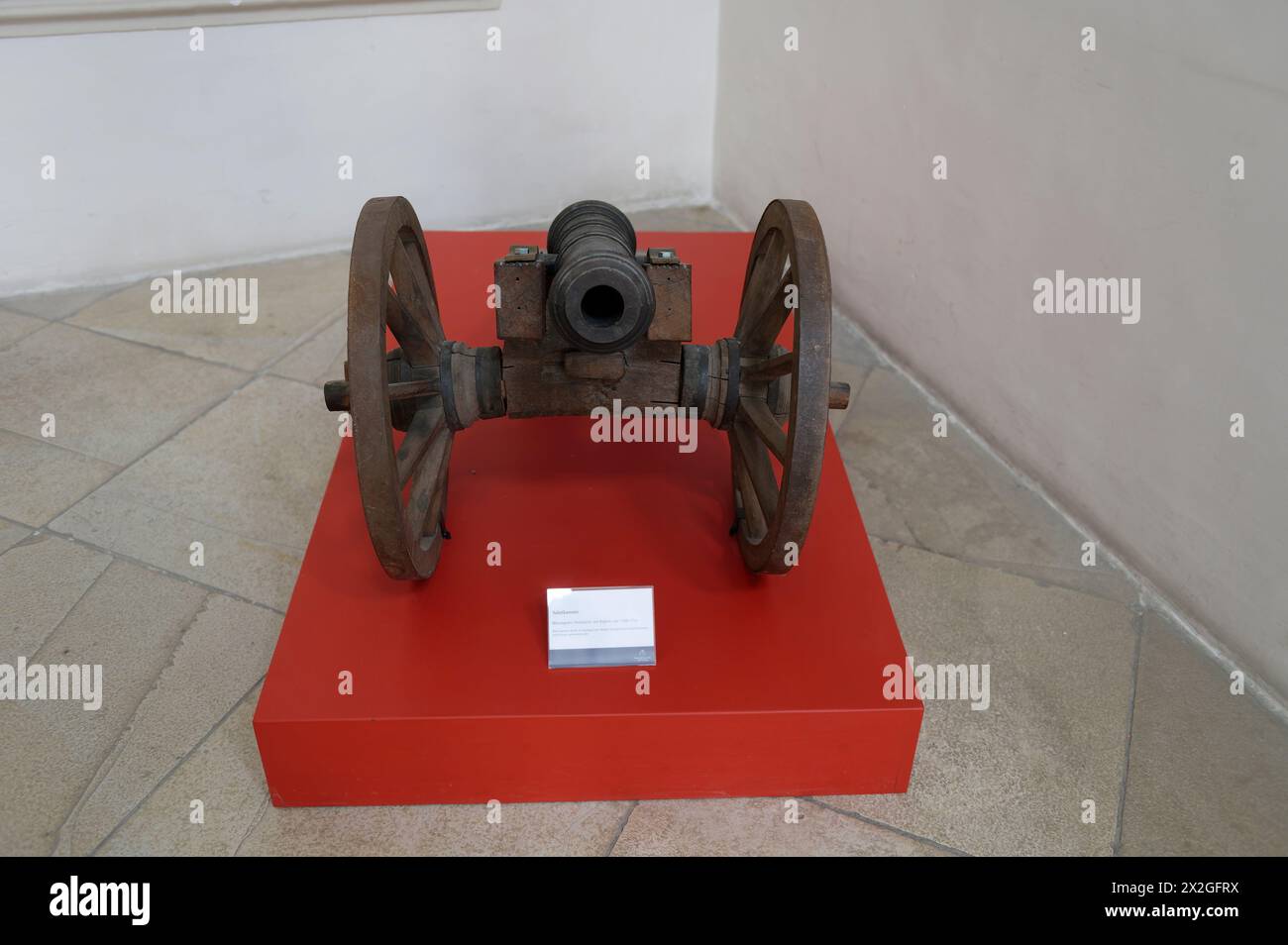 Göttweig, Lower Austria, Austria. Museum in the imperial wing of Göttweig Abbey. Salute cannon, brass tube, wooden carriage with wheels around 1720-1730 Stock Photo