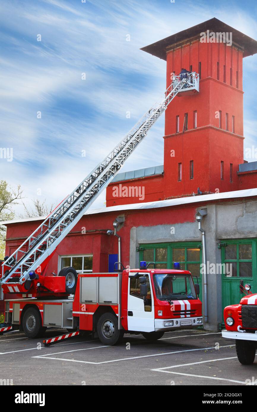 fire station, red fire truck with long ladder, red high tower Stock ...