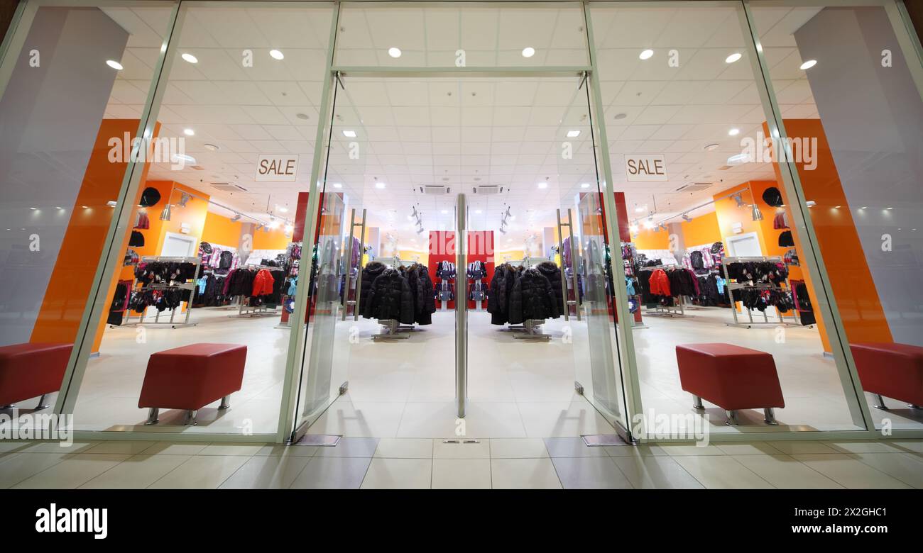 Inside fashion store of sport wear; large assortment; jackets, shirts ...