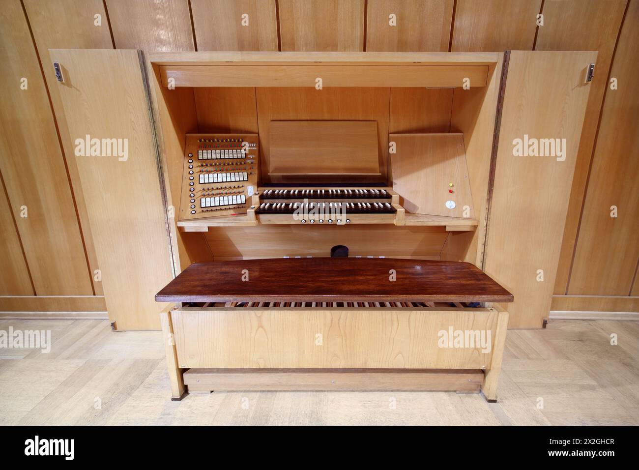 detail of wooden control panel of massive Pipe Organ; keys and switches Stock Photo