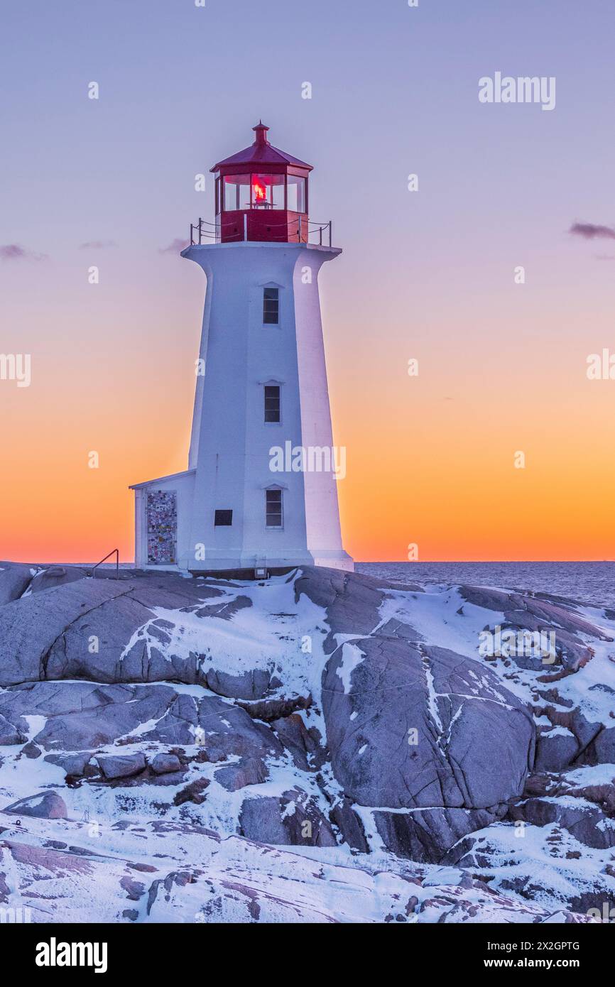 60895-04311 Peggy's Cove Lighthouse in winter at sunset Peggy's Cove ...