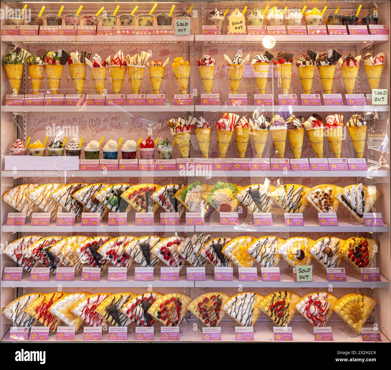 TOKYO/JAPAN - November 21, 2023:Shop window with multitude of crepes in various flavours Stock Photo