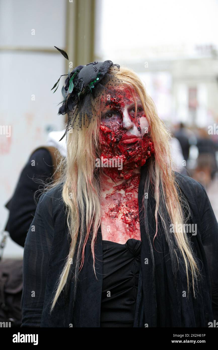 MOSCOW - MAY 14: Unidentified made-up female participant with mutilated face in mourning dress at Zombie Parade on Old Arbat, May 14, 2011, Moscow, Ru Stock Photo