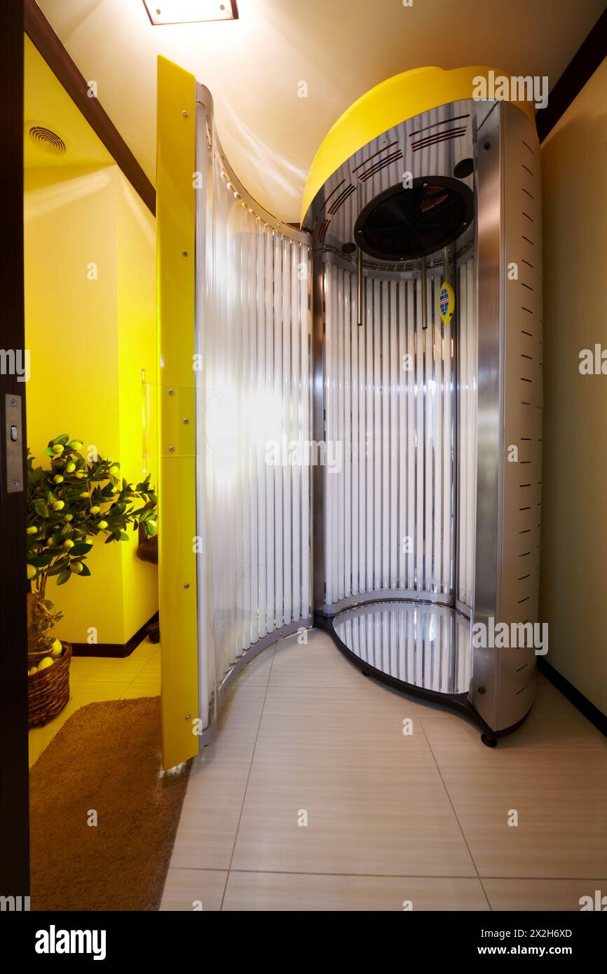 Open tanning booth in beauty salon. Stock Photo