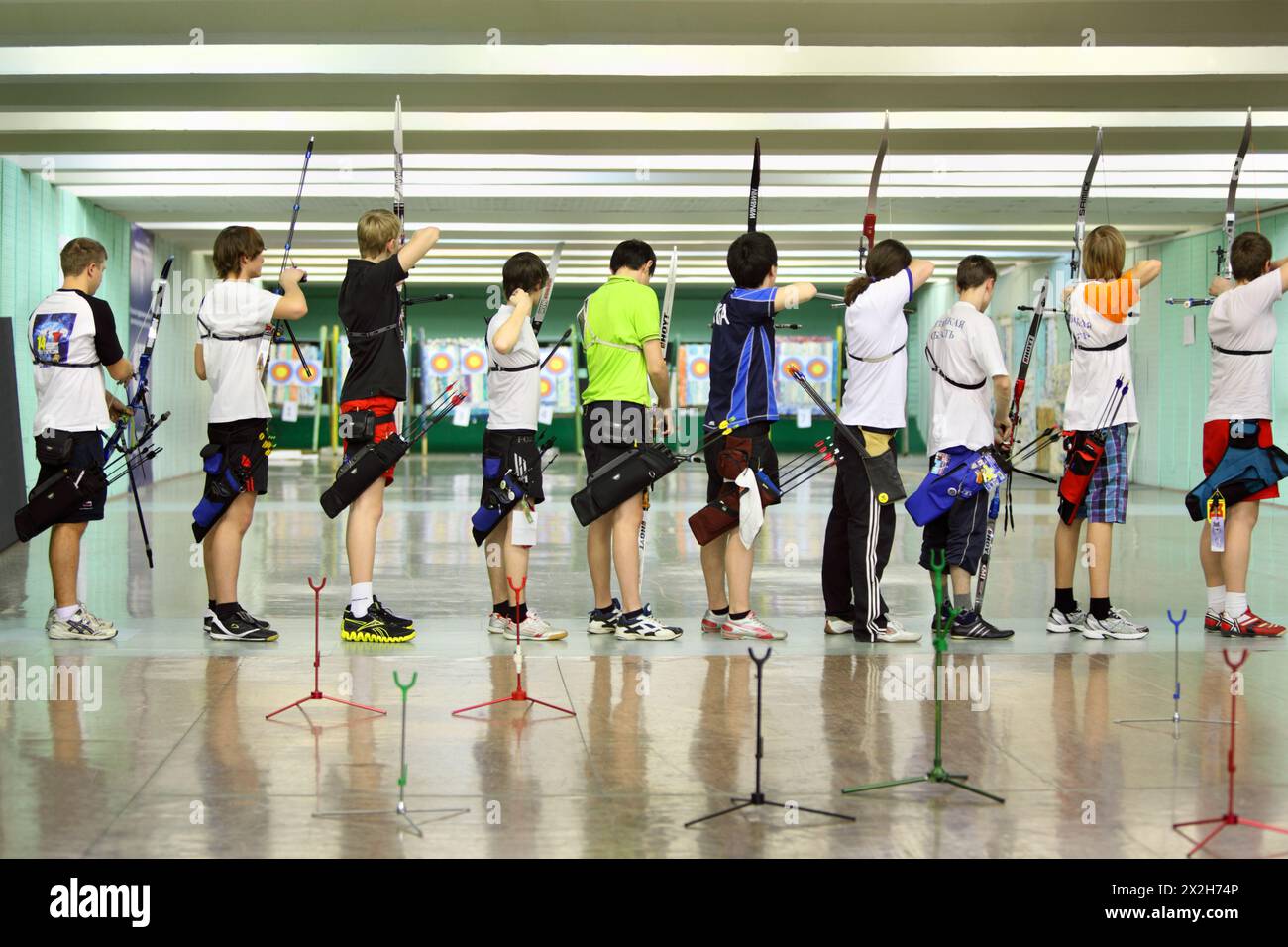 MOSCOW - APRIL 2: Backs of archers at Traditional Archery Championship among adults (undergraduate and graduate) of Russian Institute of Physical Educ Stock Photo