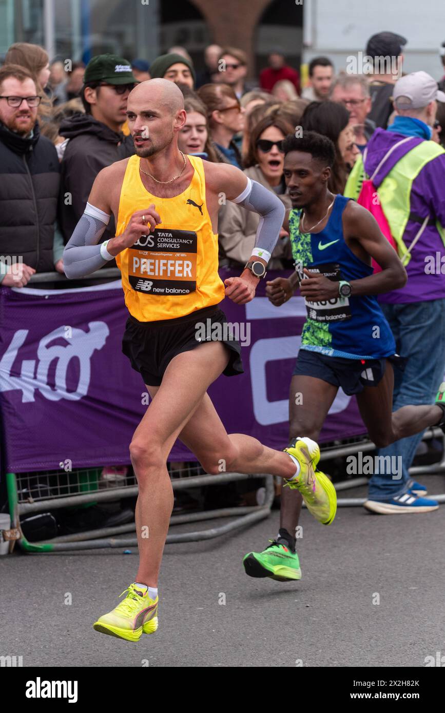 Hendrik Pfeiffer competing in the TCS London Marathon 2024 passing through Tower Hill, London, UK. Stock Photo