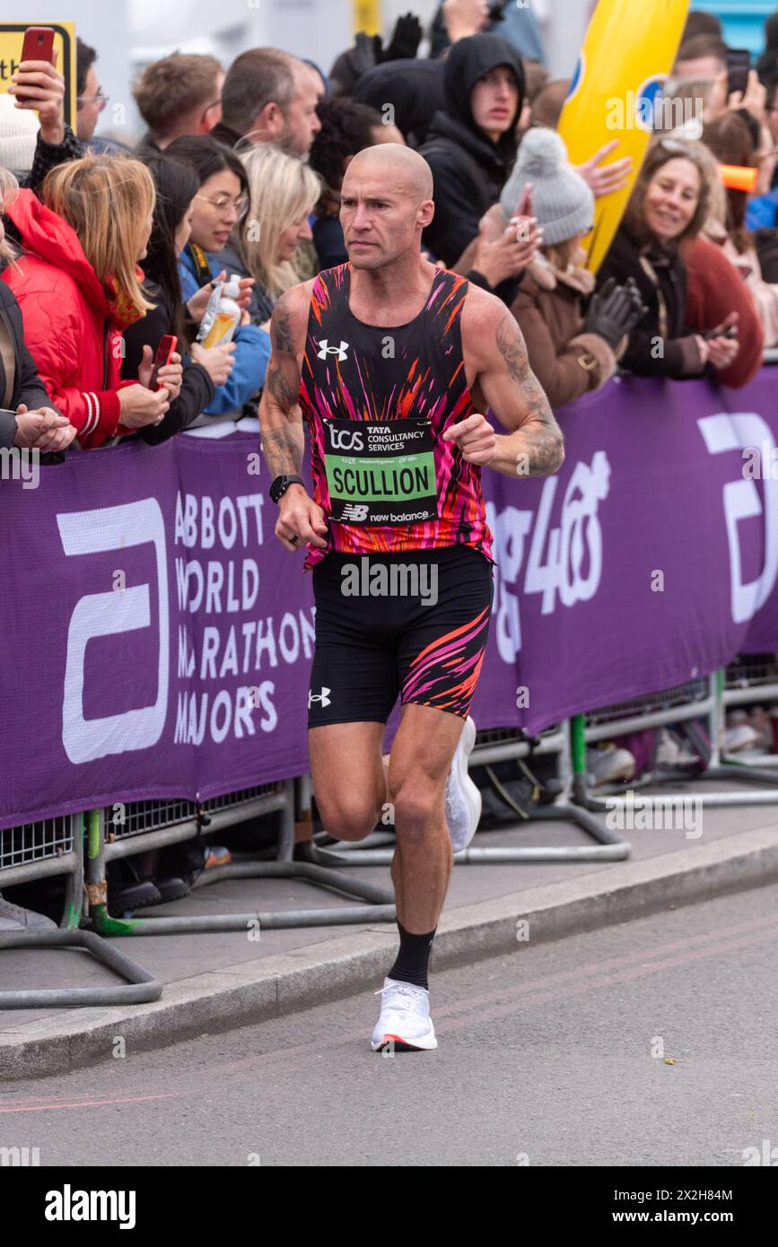 Stephen Scullion competing in the TCS London Marathon 2024 passing through Tower Hill, London, UK. Stock Photo