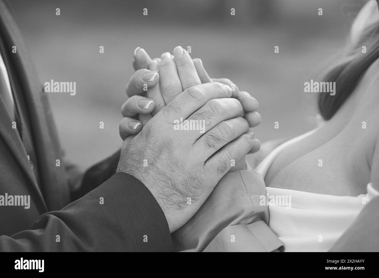 Lovers hug on the street. Close-up. Black and white Stock Photo