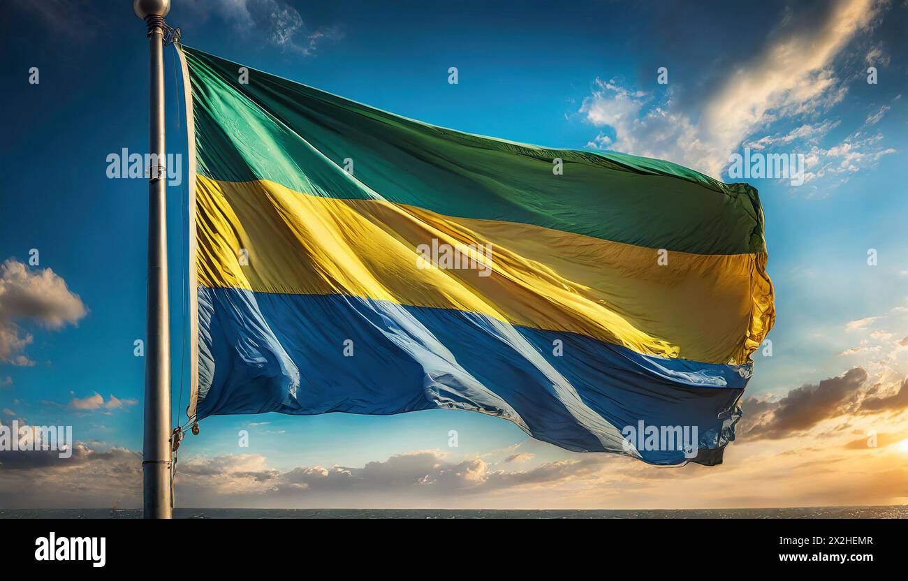 Die Fahne von Gabun flattert im Wind, isoliert gegen blauer Himmel Stock Photo