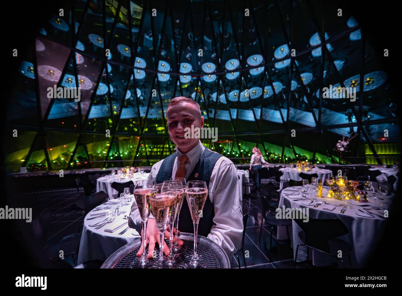 A waiter at an event at Searcys Restaurant in the Gherkin building. Photo date: Saturday, January 20, 2024. Photo: Richard Gray/Alamy Stock Photo