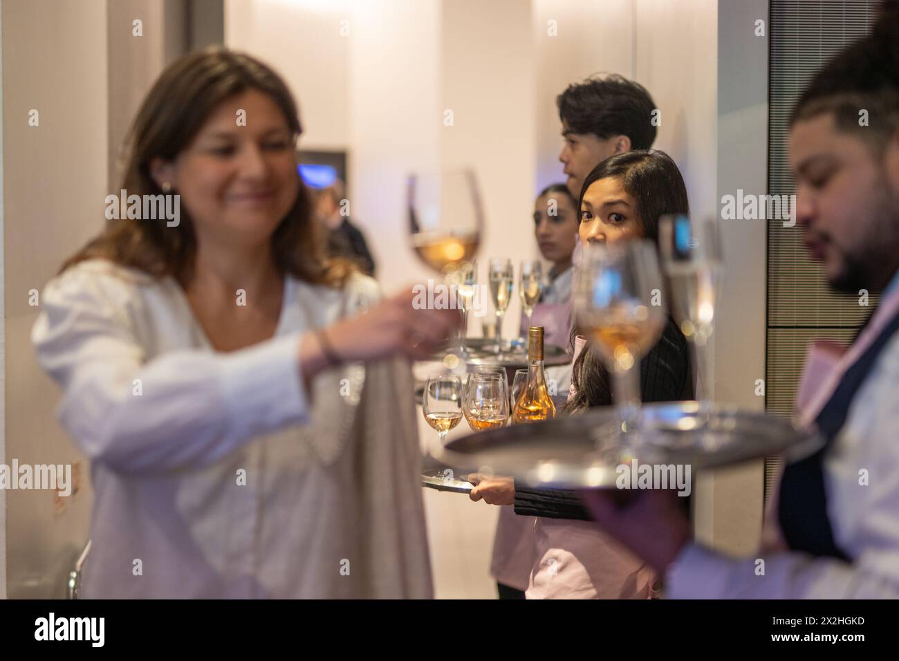 Guests being served wine at a corporate event. Photo date: Wednesday, September 27, 2023. Photo: Richard Gray/Alamy Stock Photo