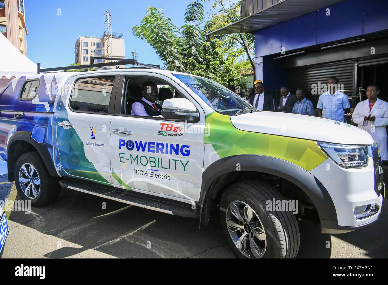 Nairobi, Kenya. 22nd Apr, 2024. Kenya Power Managing Director Joseph Siror (Front) drives a JAC electric vehicle from China in Nairobi, Kenya, on April 22, 2024. Kenya Power, the country's electricity distributor, said on Monday that it will invest 1.93 million U.S. dollars in the next three years to spur the adoption of electric vehicles (EVs) in the country. Credit: Allan Mutiso/Xinhua/Alamy Live News Stock Photo