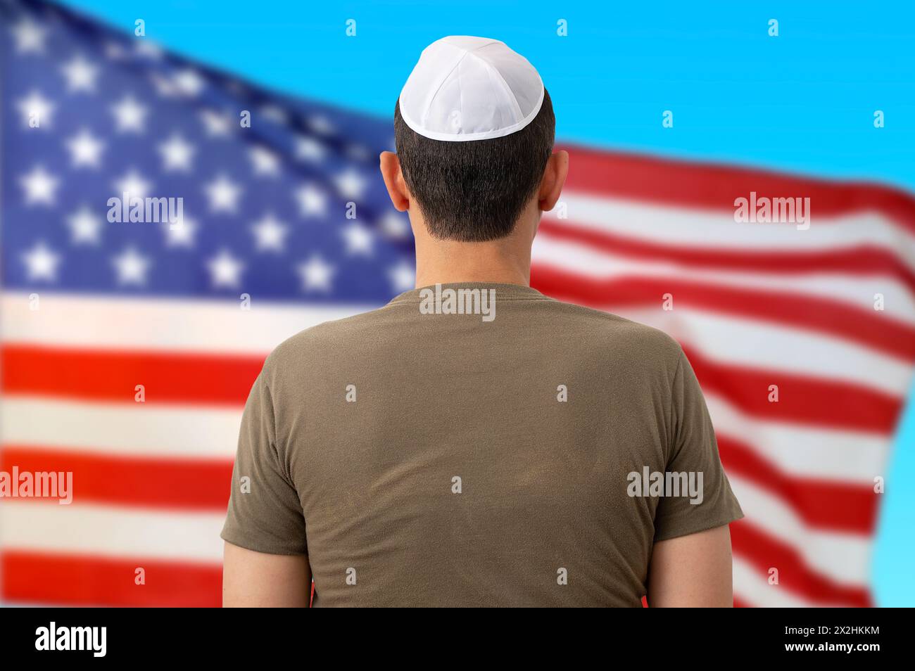 Back view of jewish citizen wearing yarmulke in front of american flag for multi-ethnicity nature of USA Stock Photo