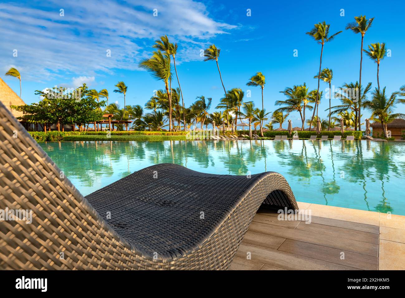 Swimming pool and palm trees in luxury resort at Pun Cana in the Dominican Republic Stock Photo