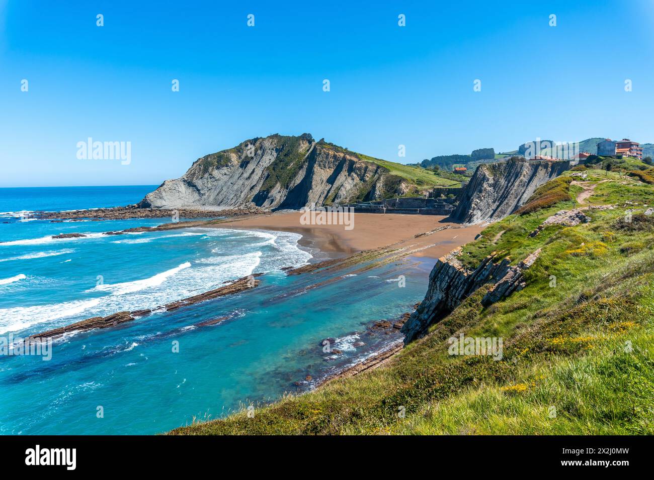 Beautiful Itzurun beach from Cala de Algorri in the Flysch Basque Coast geopark in Zumaia, Gipuzkoa Stock Photo