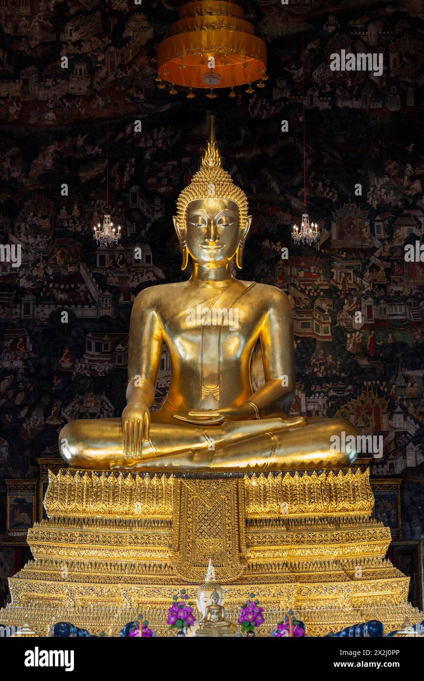 Golden Buddha statue, Bhumispara-mudra, Buddha Gautama at the moment of enlightenment, Wat Suthat Thepwararam, Bangkok, Thailand Stock Photo