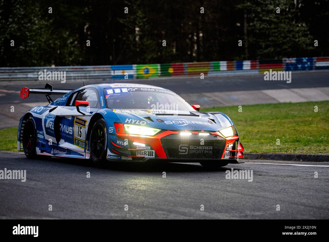 The car with the number 15 from Team Scherer drives in dimmed lights at ...