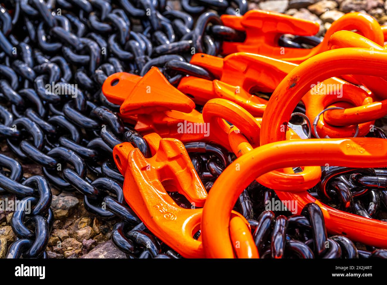 Heavy, thick chains made of steel, black chain links, orange painted hooks, Germany, Stock Photo