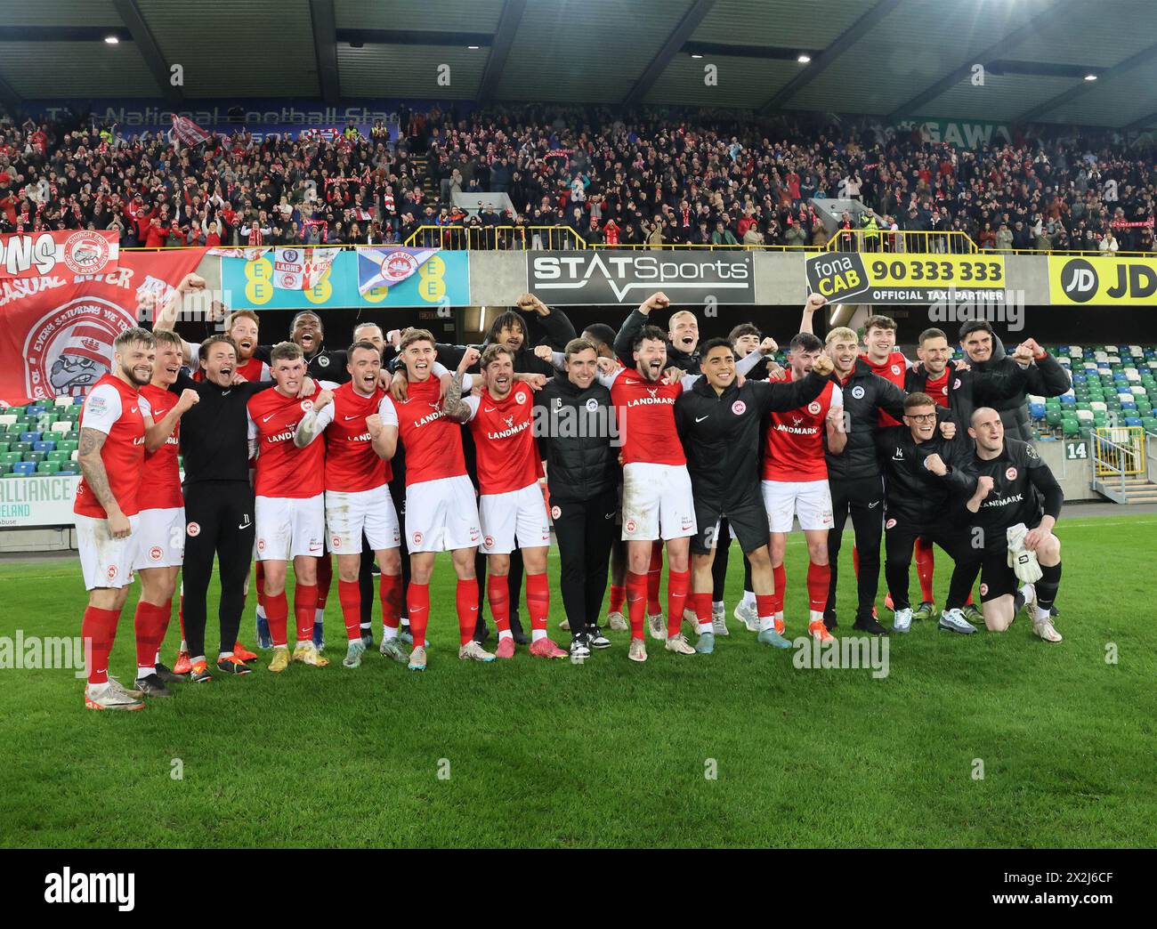 Windsor Park, Belfast, Northern Ireland, UK. 22nd Apr 2024. Sports Direct Premiership – Linfield v Larne. Larne fans, players and manager Tiernan Lynch celebrate winning the Premiership following their 1-1 draw with Linfield this evening .(They are three points clear with one game to play and a vastly superior goal difference +17 over second-placed rivals Linfield). Credit: CAZIMB/Alamy Live News. Stock Photo