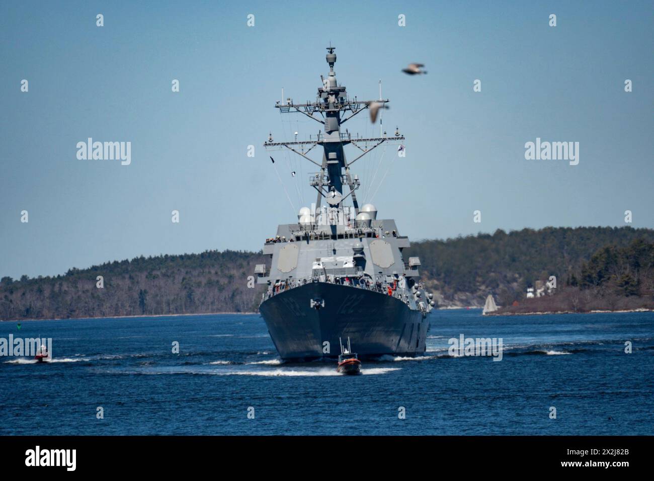 Bath, United States. 08 April, 2024. The U.S. Navy Arleigh Burke-class guided-missile destroyer USS John Basilone transits the Kennebec River to the Atlantic Ocean to conduct four-days of sea trials, April 8, 2024 in Bath, Maine.  Credit: CPO Sherwin Thomas/U.S. Navy Photo/Alamy Live News Stock Photo