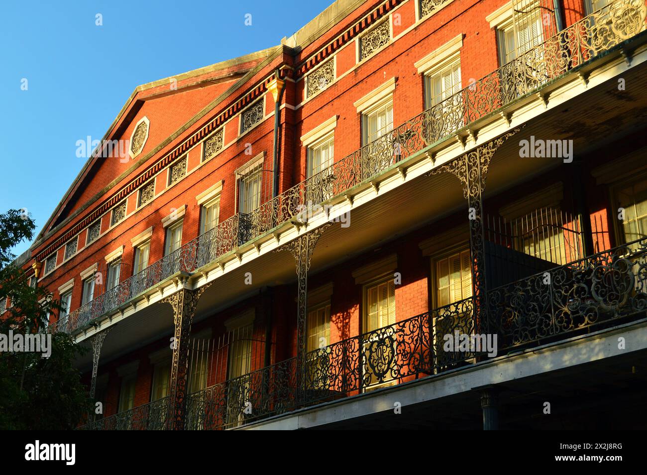 The intricate and ornate iron railings of the LaBranche Building in the French Quarter of New Orleans Stock Photo