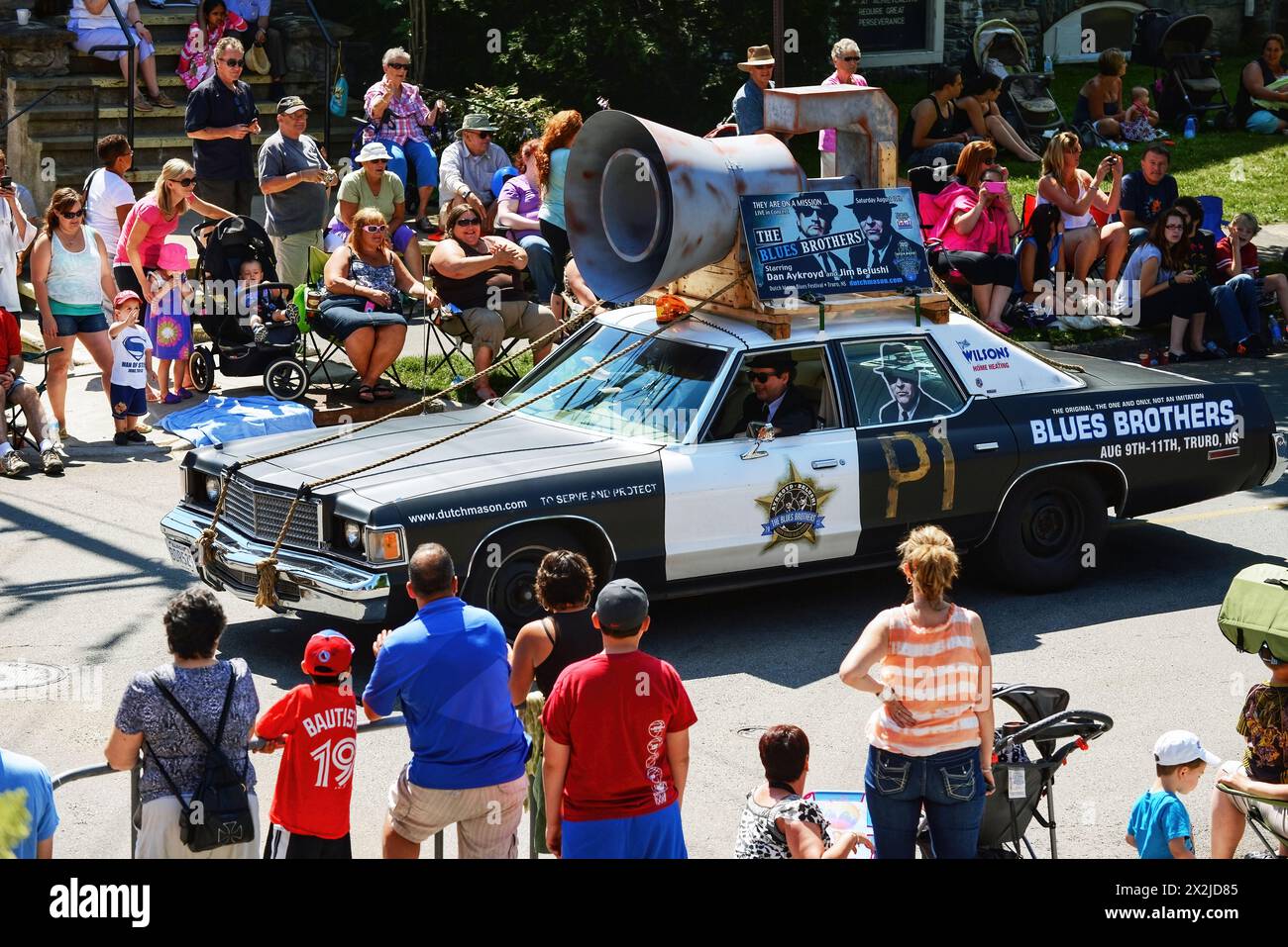 Dartmouth, Canada - August 5, 2013: The iconic Blues Brothers car is part of the annual Natal Day Parade in the Halifax Regional Municipality. They ar Stock Photo