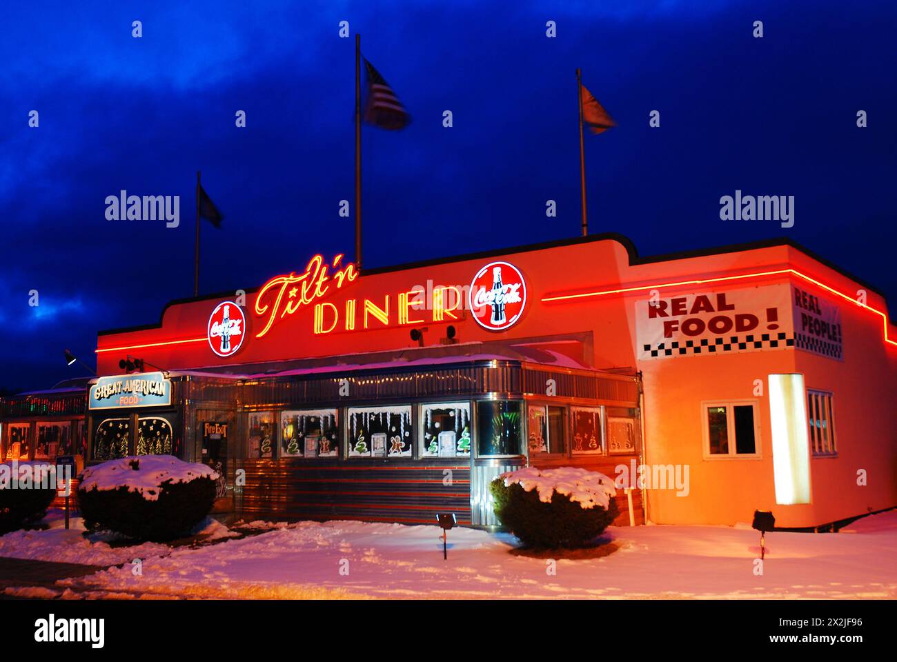 The Tilt’n diner glows in the twilight on a winter’s night Stock Photo