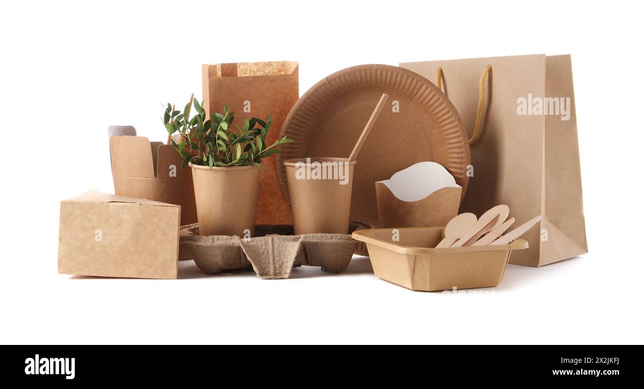 Eco friendly food packagings, tableware, paper bags and twigs isolated on white Stock Photo
