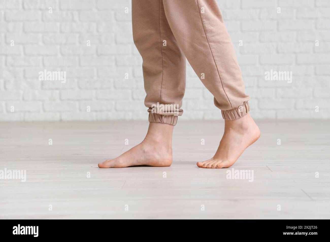 Walking barefoot girl in white hi-res stock photography and images - Alamy