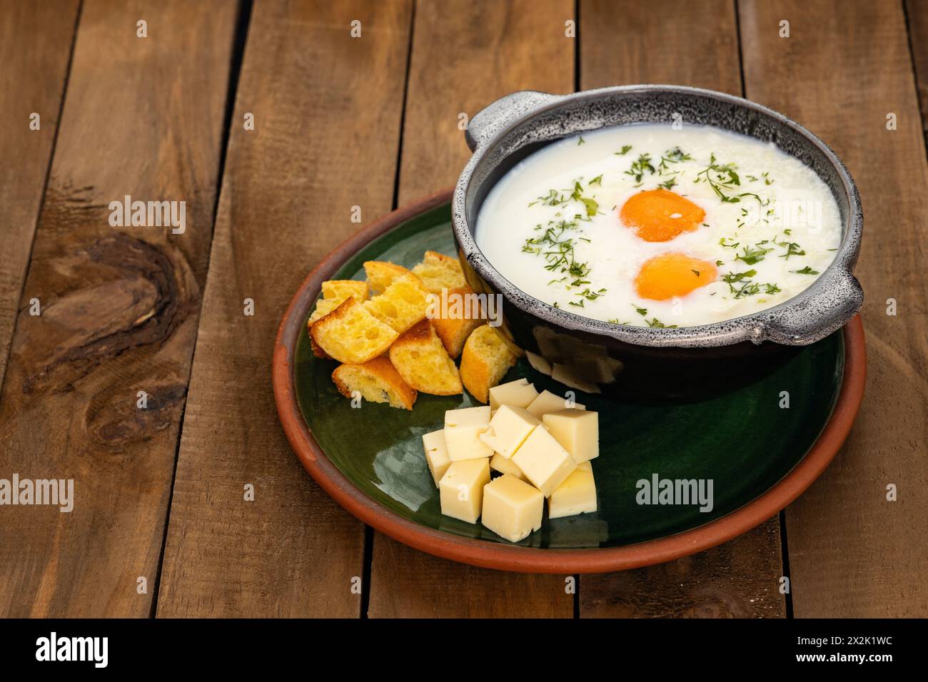 Changua is a soup made with milk, egg and onion - Typical Colombian breakfast Stock Photo