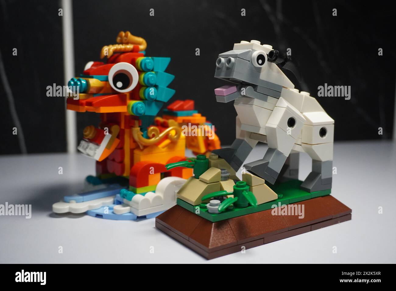 Lego in the form of a dragon and a sheep representing the zodiac signs Stock Photo