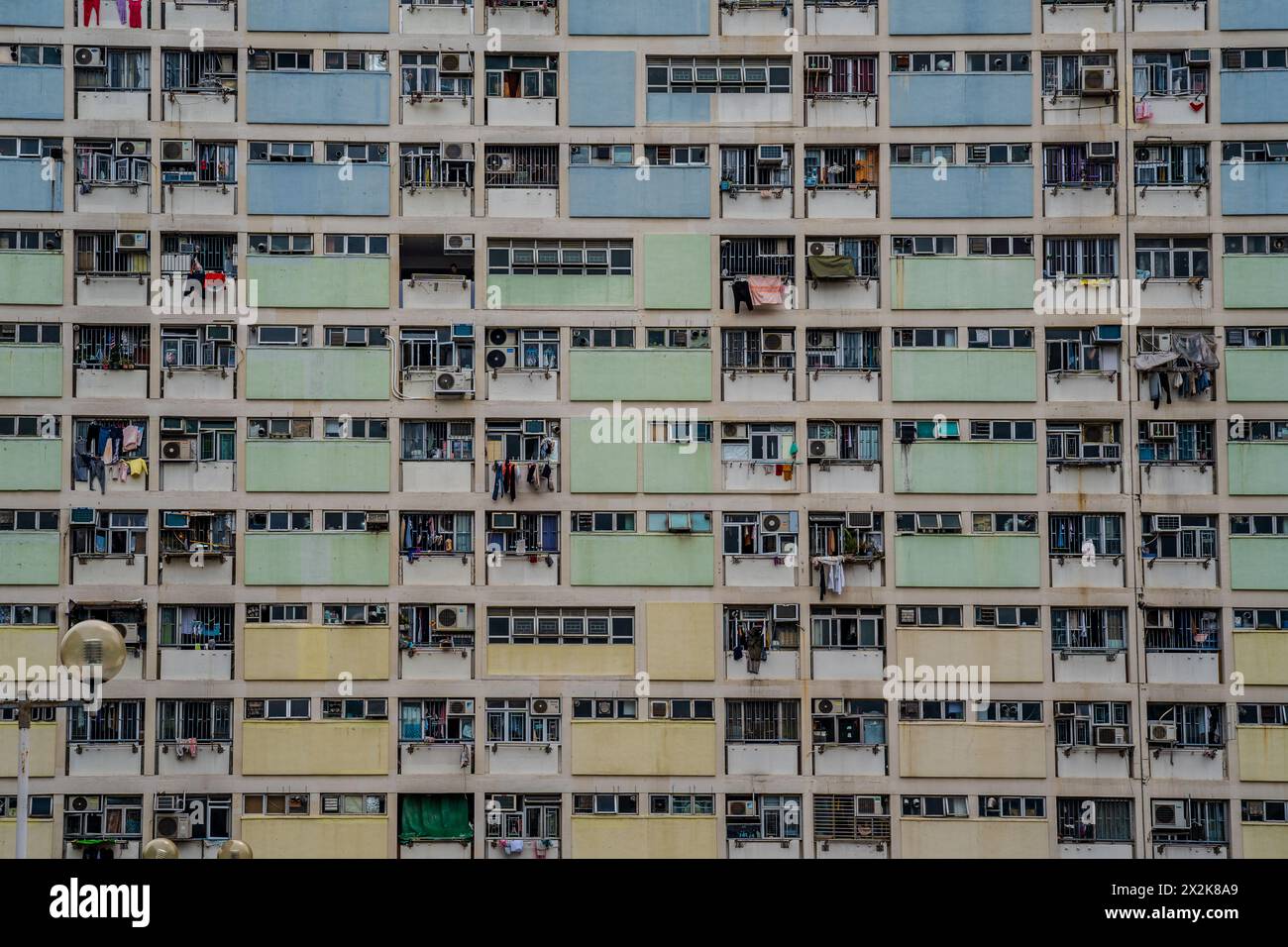 Detailed view of a highdensity residential building showing numerous windows, balconies, and