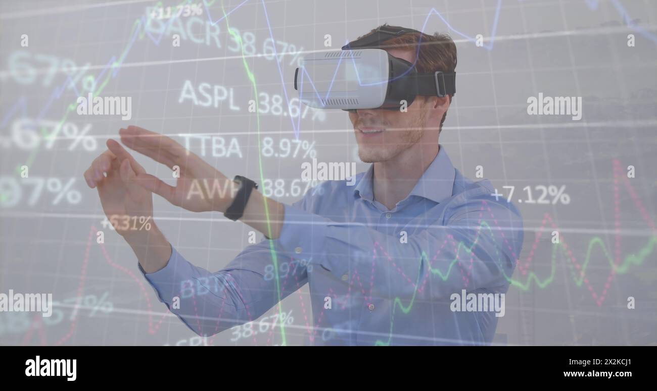 Image of trading board and graphs over caucasian businessman gesturing using vr headsets Stock Photo