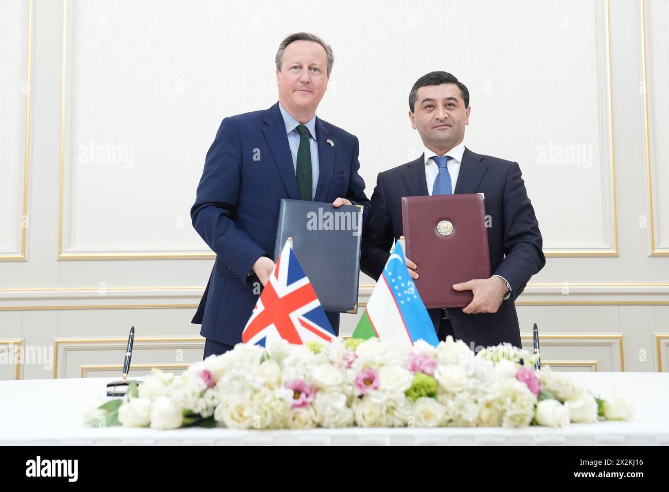 Foreign Secretary Lord David Cameron and Uzbekistan Foreign Minister, Bakhtiyor Saidov, during a signing ceremony at the Ministry of Foreign Affairs in Tashkent, as he visits Uzbekistan during his five day tour of the Central Asia region. Picture date: Tuesday April 23, 2024. Stock Photo