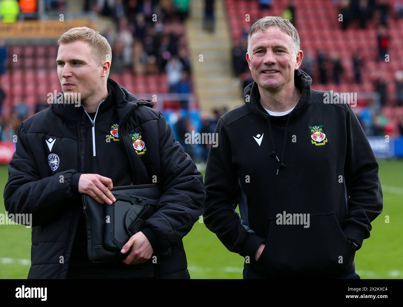 Wrexham manager Phil Parkinson (right) celebrates at the end of the match with Performance Analyst George Parkinson following the Sky Bet League Two match at the Mornflake Stadium, Crewe. Picture date: Saturday April 20, 2024. Stock Photo