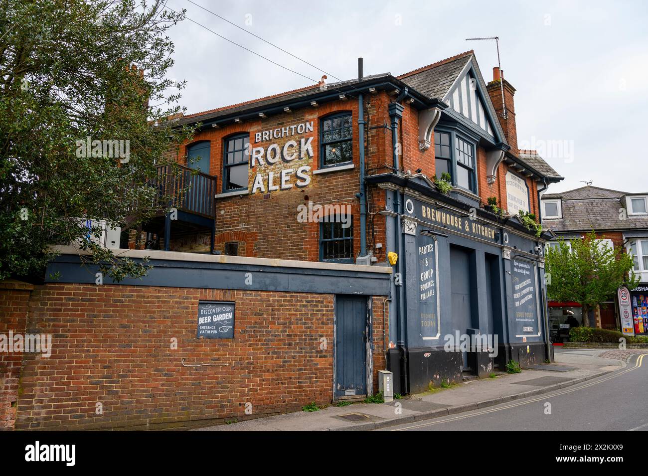 The Brewhouse & Kitchen building with hand painted vintage advert, is a craft beer pub and restaurant in Horsham market town in West Sussex, England. Stock Photo