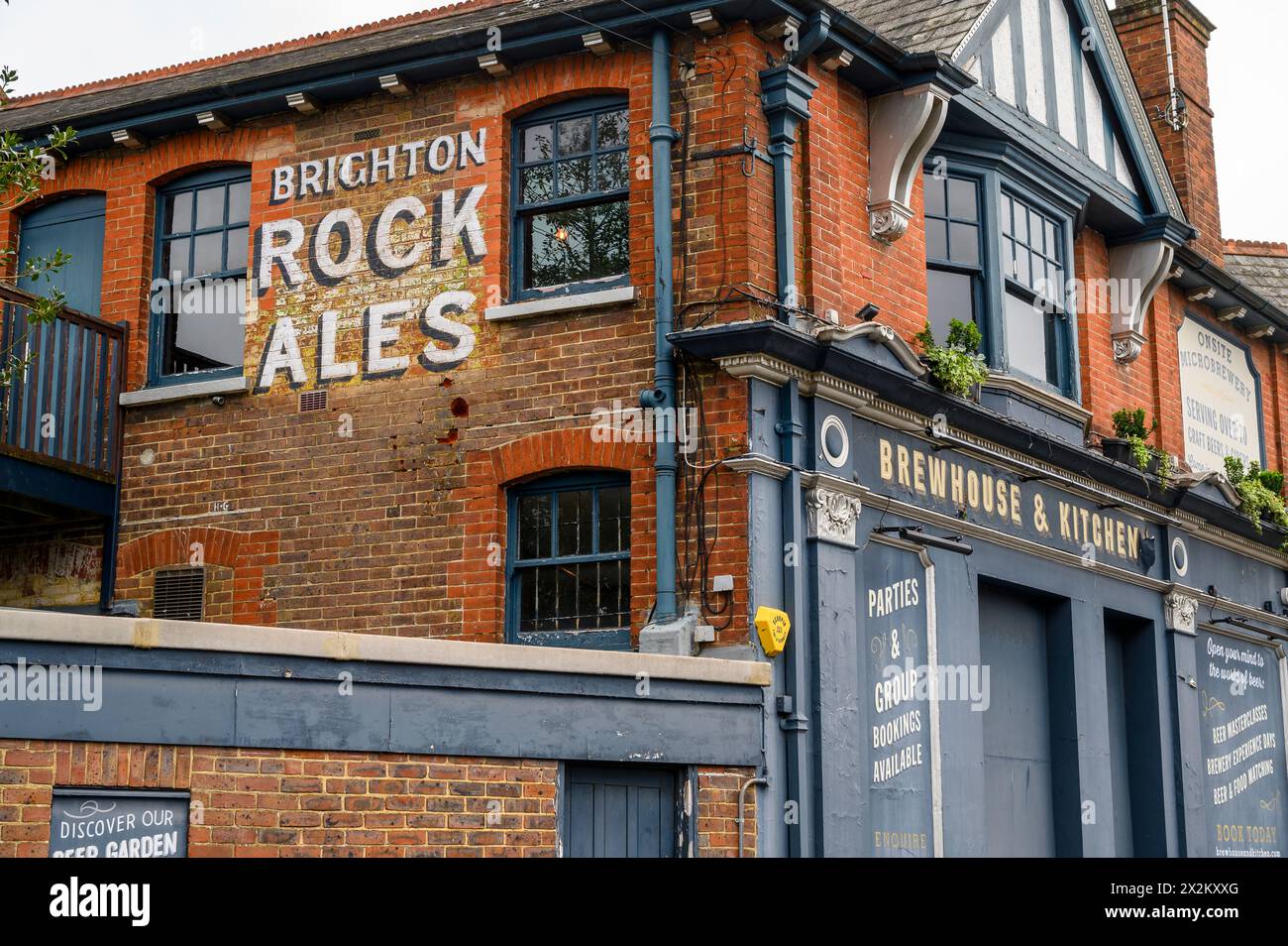 The Brewhouse & Kitchen building with hand painted vintage advert, is a craft beer pub and restaurant in Horsham market town in West Sussex, England. Stock Photo
