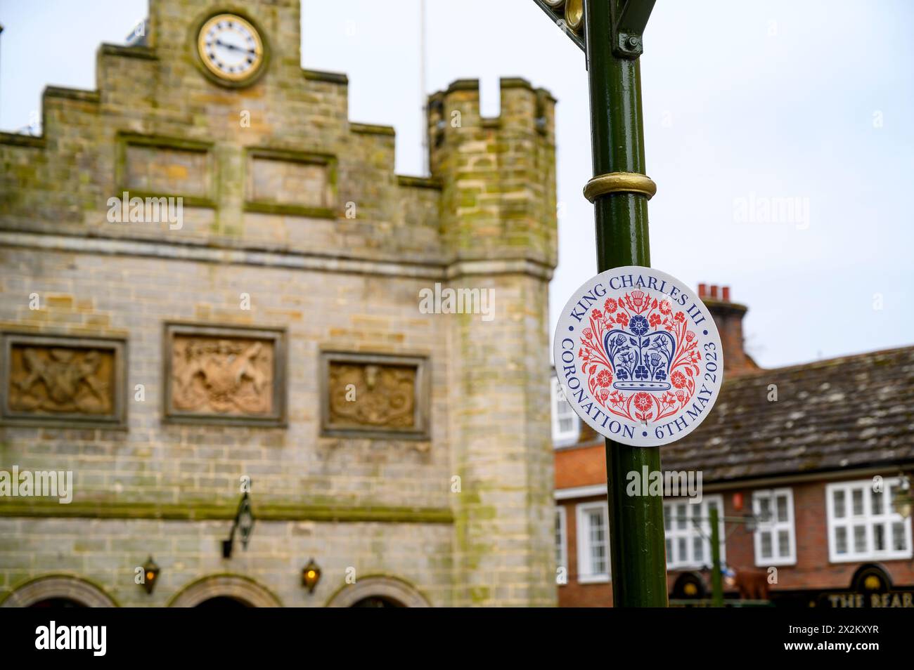 A temporary plaque commemorating King Charles' coronation in front of the Old Town Hall in the historic market town Horsham in West Sussex, England. Stock Photo