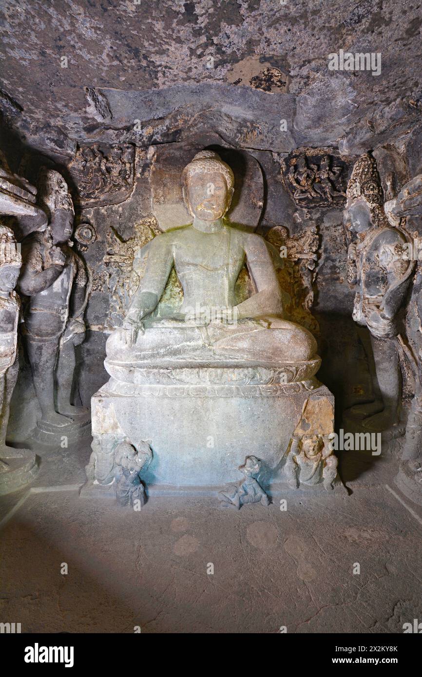 Ellora Buddhist Caves: Cave No 11 The large seated Buddha, his hand in bhumisparsa (touching earth) mudra, sits upon a throne Stock Photo