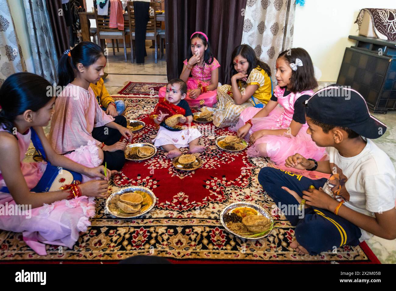 April19th2024 Dehradun City, India. Dehradun: Young girls honored in Navratri festival, a holy ritual for Hindu Goddesses. Stock Photo