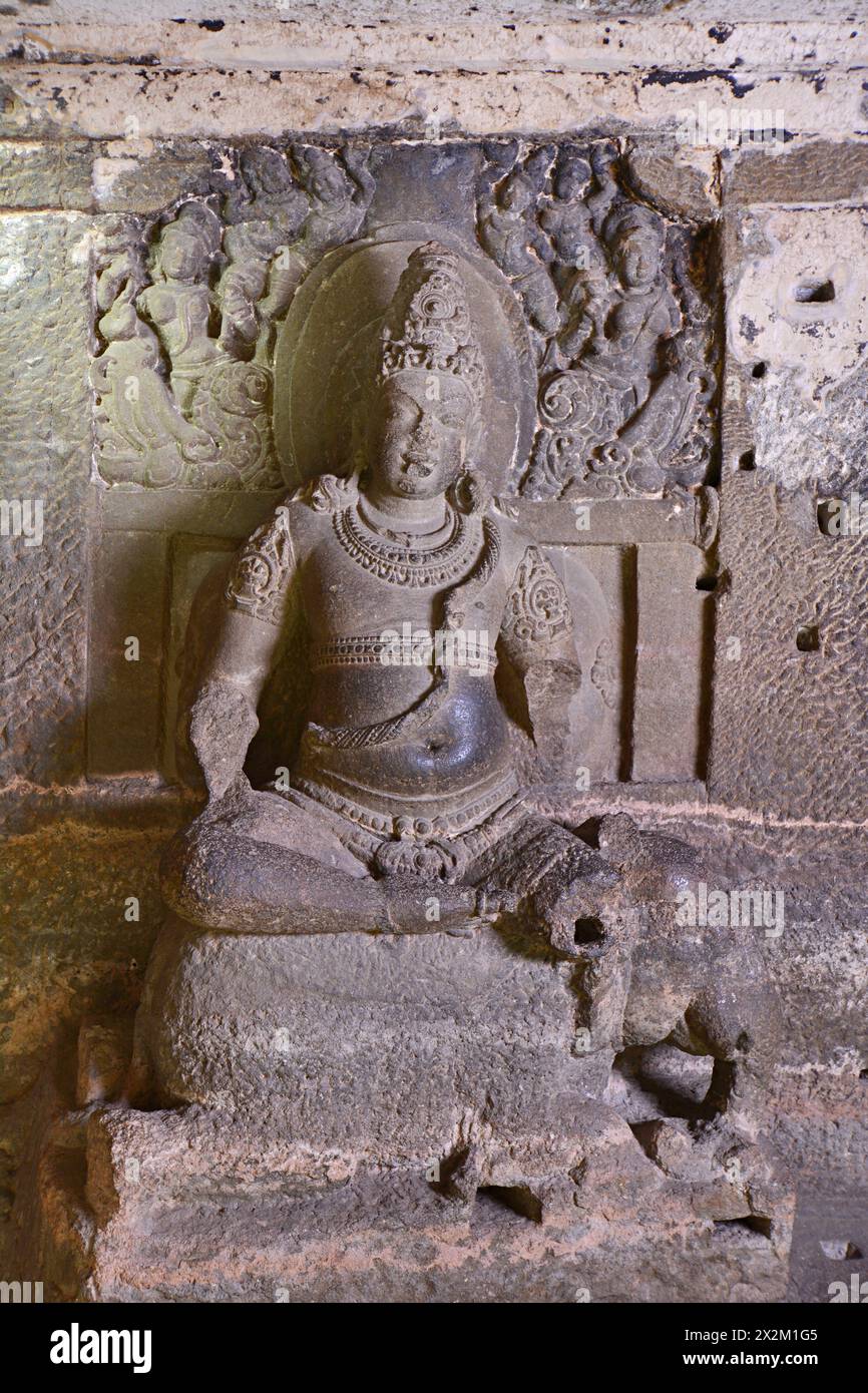 Ellora Jain Caves: Cave No 32 Ground Floor- Matanga seated on elephant on the left of the shrine door, he is adorned with an elaborate crown and jewel Stock Photo