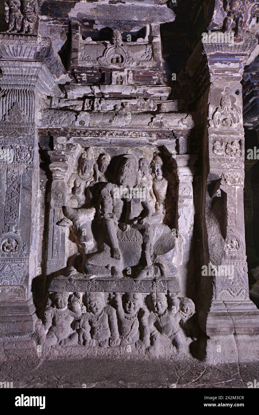 Ellora Brahmanical Caves: Kailas a No 16- Upper storey -Shiva on Nandi in a niche with gana figures below. Stock Photo