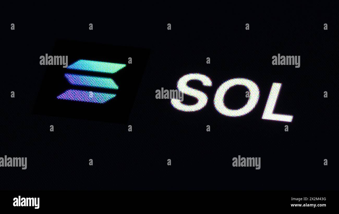 Solana SOL cryptocurrency logo on the screen of smartphone in mans hand  with downtrend on the chart on a red light background, February 2022, San  Francisco, USA Stock Photo - Alamy
