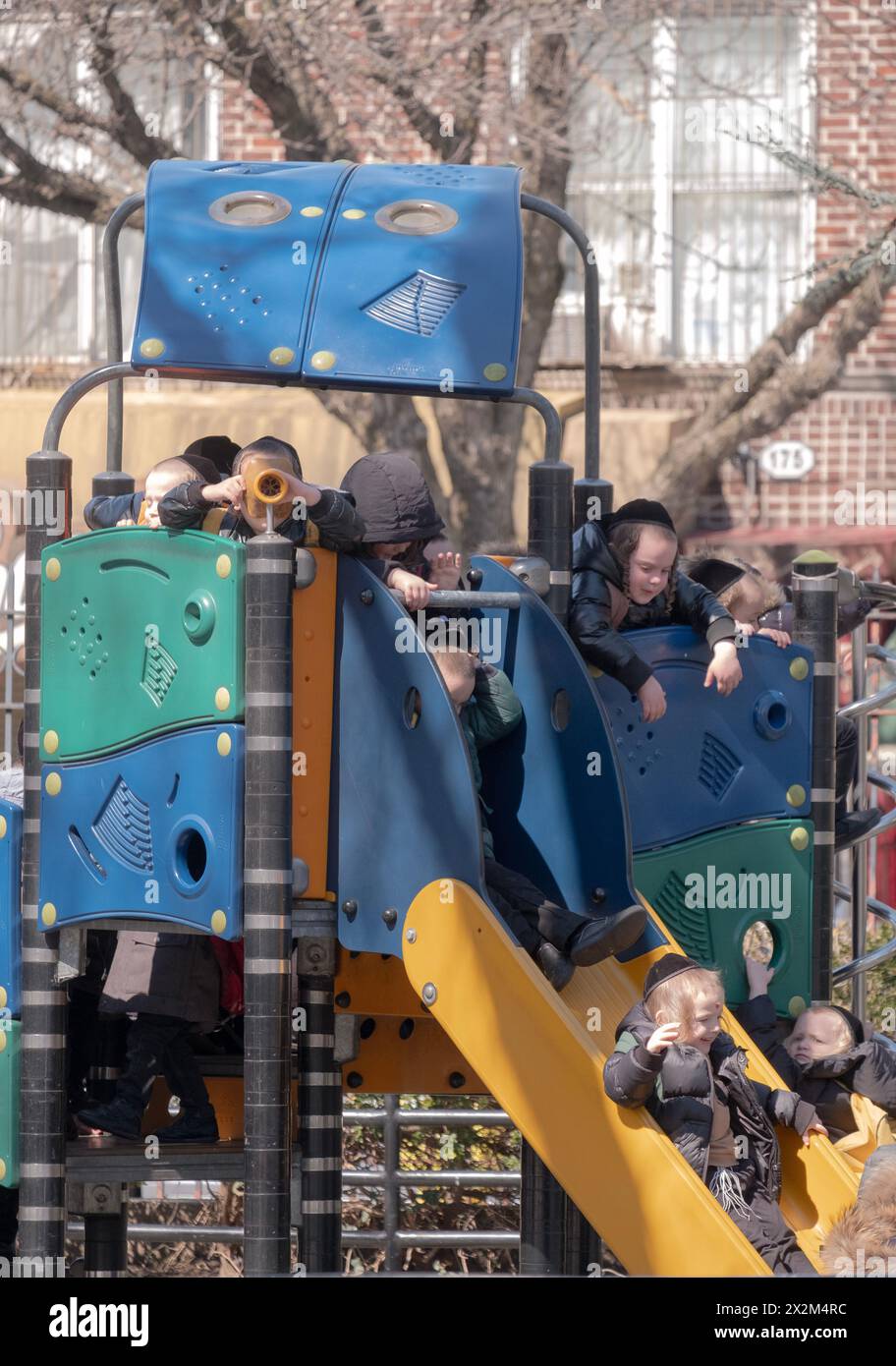 Playful orthodox Jewish children play at Sobel Playground during recess at their yeshiva. In Brooklyn, New York Spring 2024. Stock Photo