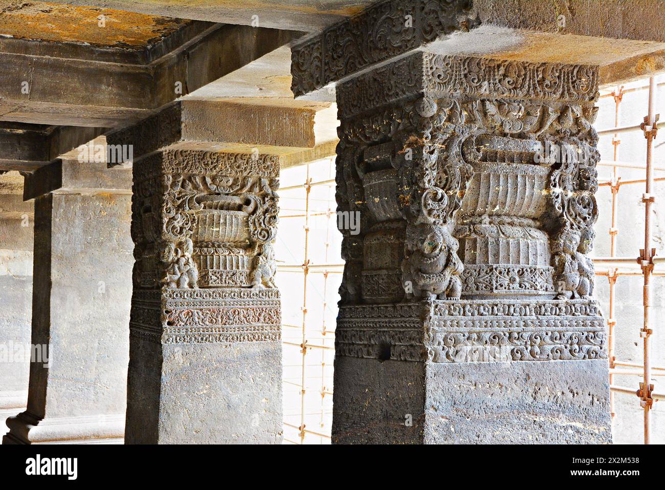 Ellora Buddhist Caves: Cave No 12 Upper wing, second storey showing Ghata pallava (leaf and foliage) motive with Gana (dwarf) figures on the pillars. Stock Photo