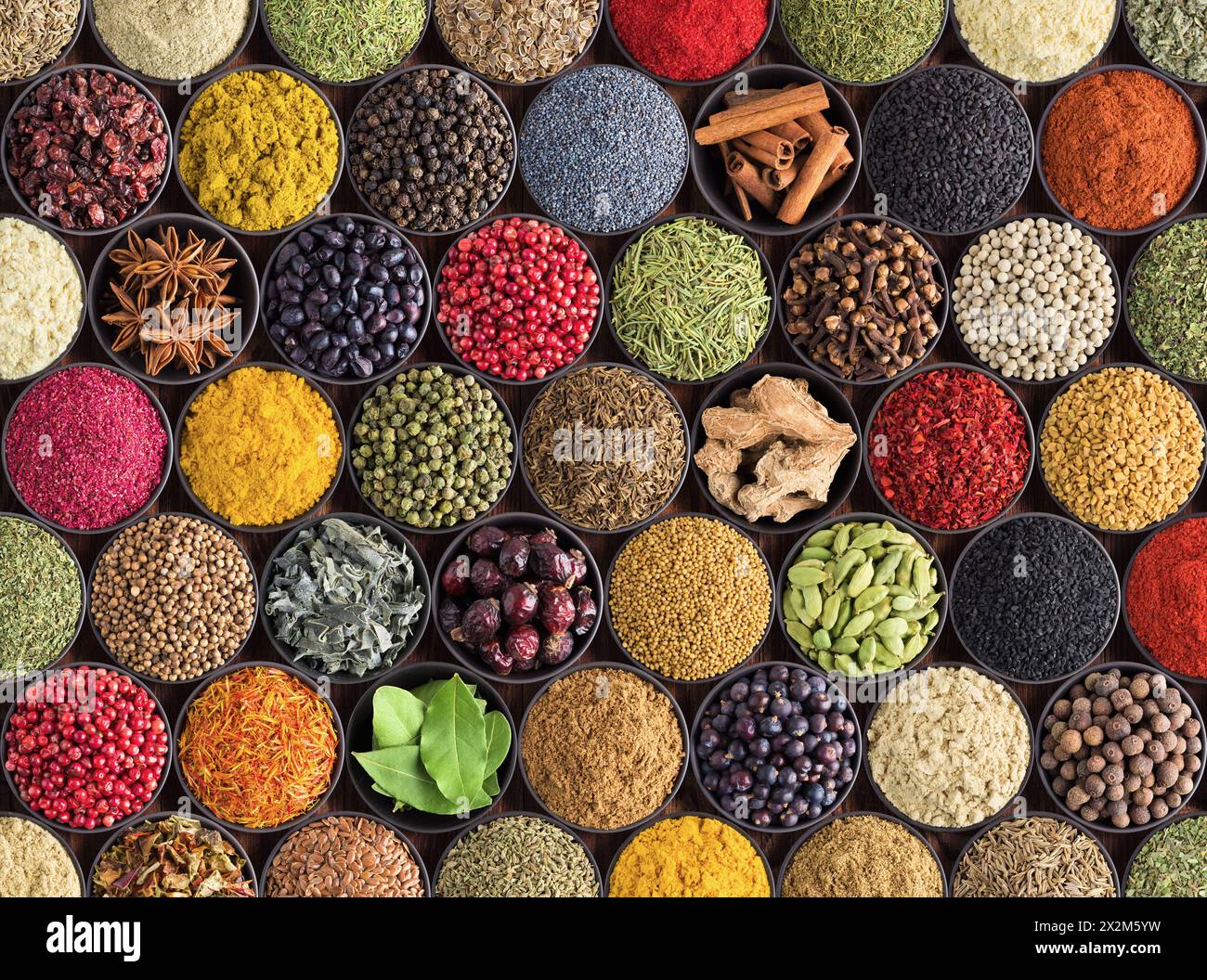 Spices and herbs background. Large set of seasoning top view. Colorful condiments for label prints or site caps Stock Photo